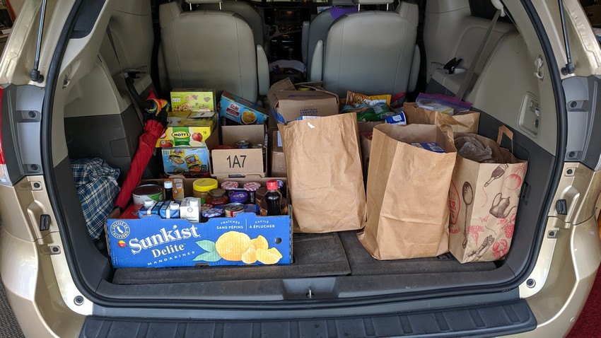 Photo of bags of food in the back of a van